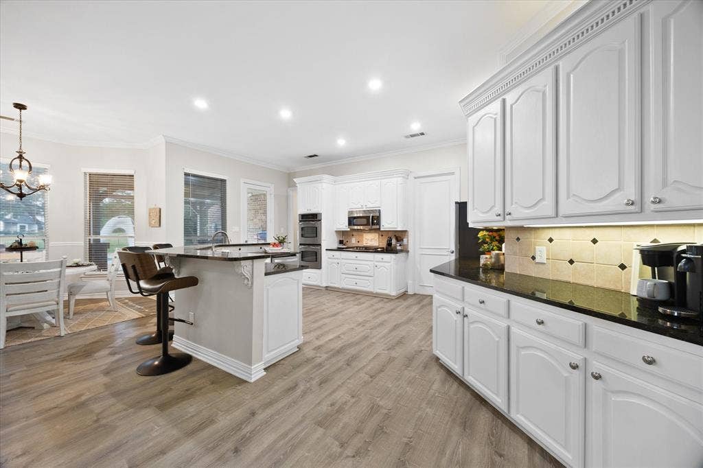 621 Liechty Court, Heath, TX 75032 Open floor plan features dream kitchen overlooking breakfast area and family room