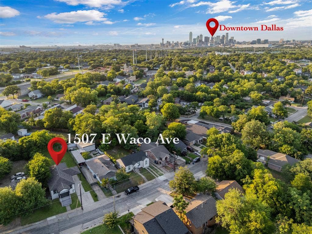 1507 E Waco Avenue, Dallas, TX 75216 Aerial view showcasing a residential neighborhood with abundant mature trees and proximity to the Downtown Dallas skyline