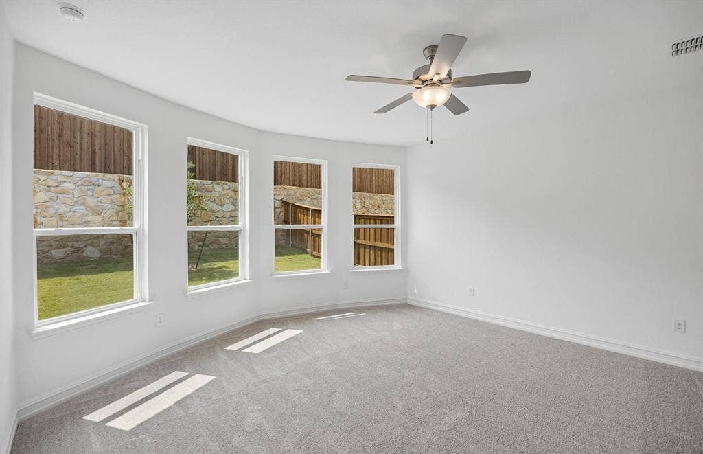 Primary bedroom with bay windows
