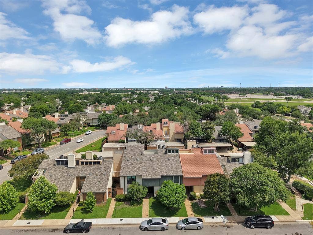 12574 Burninglog Lane, Dallas, TX 75243 Aerial perspective showcasing a residential neighborhood with varied roofing materials