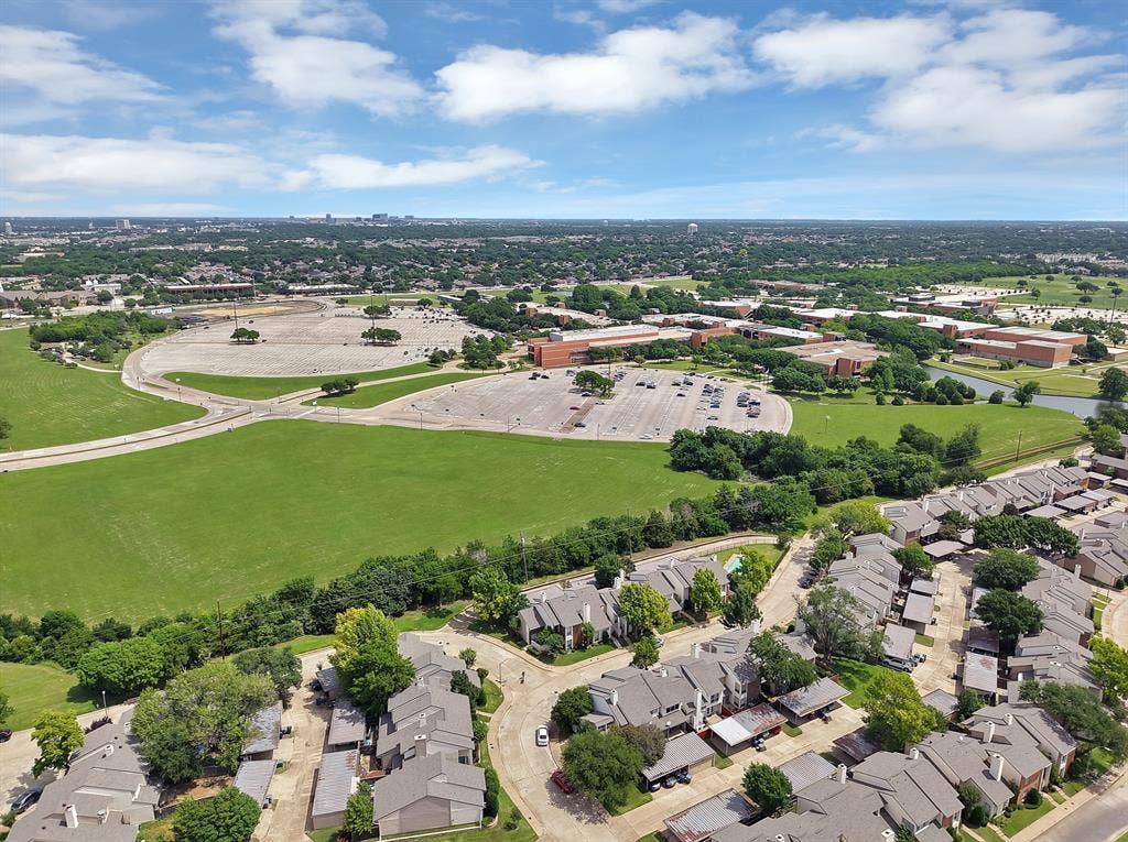 12574 Burninglog Lane, Dallas, TX 75243 Aerial perspective showcasing a residential community with asphalt shingle roofs