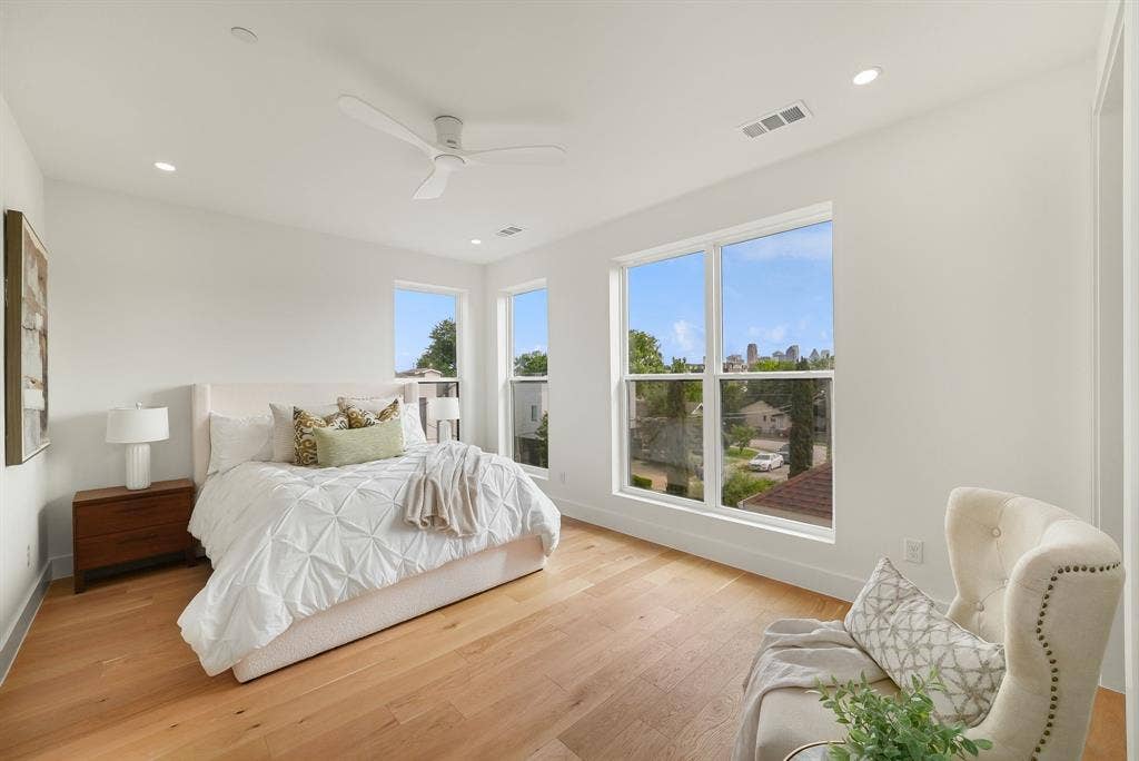 4715 Manett Street, #102, Dallas, TX 75204 Bright bedroom featuring wide plank wood-finish flooring, recessed lighting, and a ceiling fan