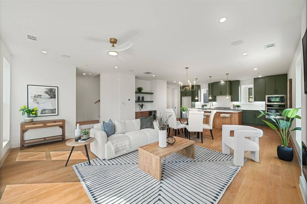 4715 Manett Street, #102, Dallas, TX 75204 Open-concept living space featuring wood-finish flooring, recessed lighting, and a modern ceiling fan