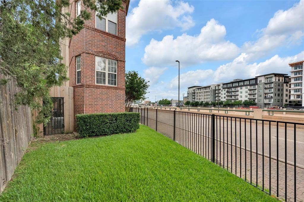 5102 Ridgedale Avenue, Dallas, TX 75206 Brick exterior featuring multiple windows with arched detailing