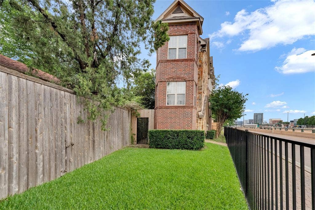 5102 Ridgedale Avenue, Dallas, TX 75206 Brick exterior featuring multiple windows and architectural gables