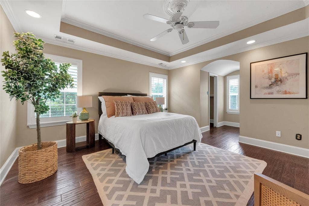 5102 Ridgedale Avenue, Dallas, TX 75206 Hardwood flooring throughout this room featuring a tray ceiling with a ceiling fan