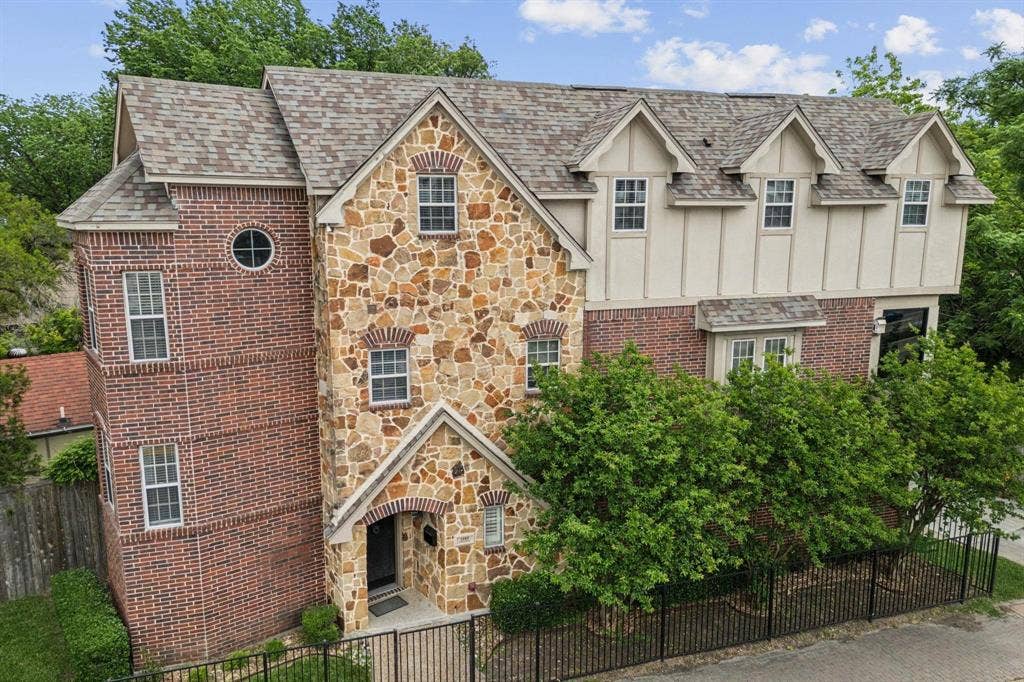 5102 Ridgedale Avenue, Dallas, TX 75206 Multi-story facade featuring a prominent stone and brick exterior