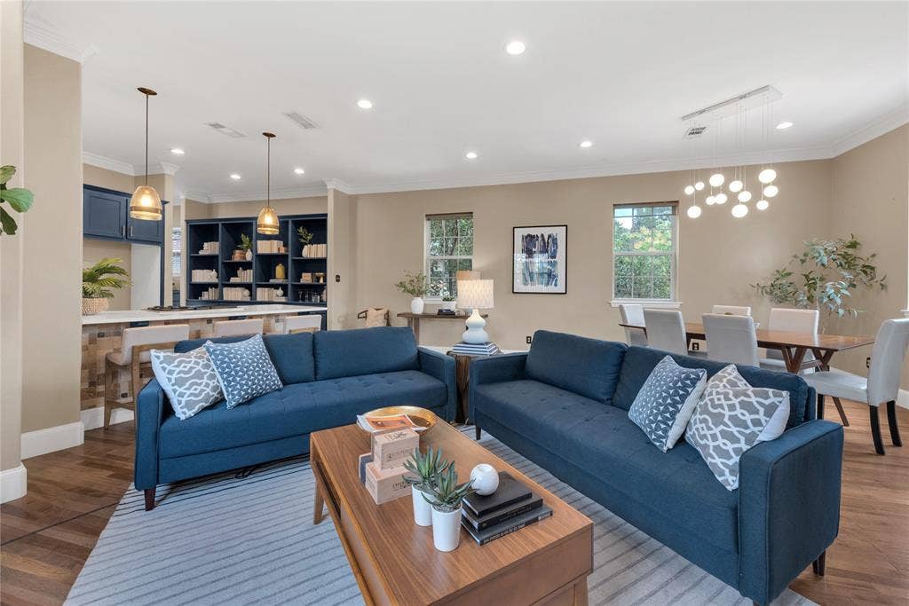 5102 Ridgedale Avenue, Dallas, TX 75206 Open-concept living space featuring wood-finish flooring, recessed lighting, and crown molding