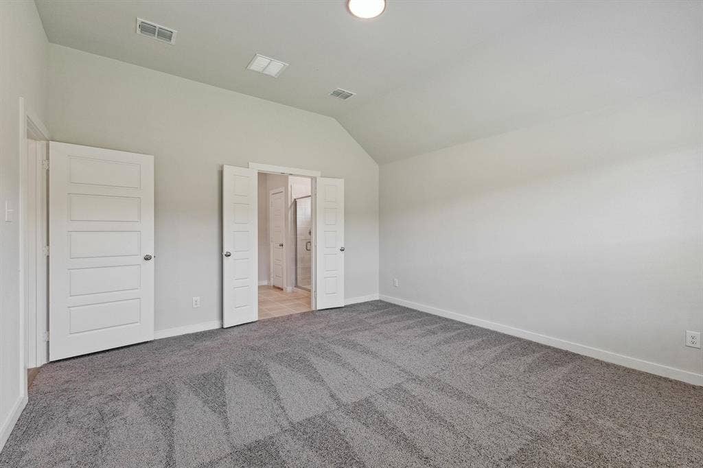 Primary bedroom in the Quartz home plan by Trophy Signature Homes – REPRESENTATIVE PHOTO