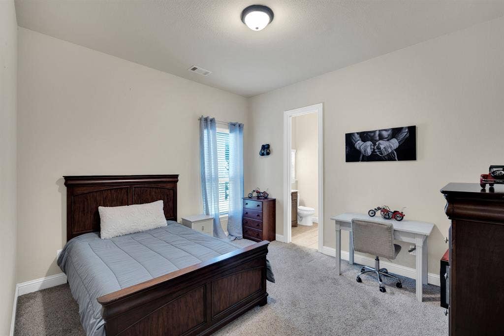 Downstairs guest bedroom with ensuite bathroom.