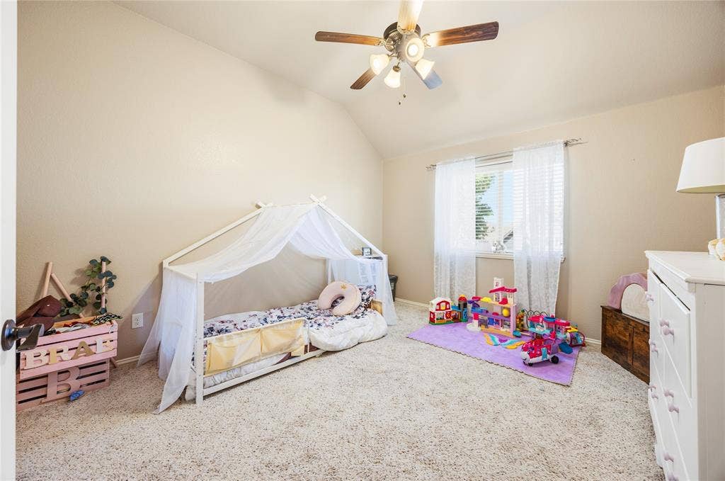 1133 Vickery Drive, DeSoto, TX 75115 5th Bedroom - 2nd floor, featuring vaulted ceiling room, carpet, ceiling fans, window with blinds.