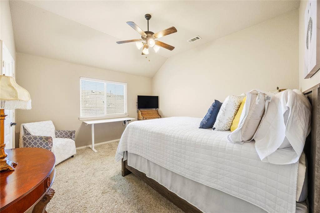 1133 Vickery Drive, DeSoto, TX 75115 3rd Bedroom - 2nd floor, featuring vaulted ceiling room, ceiling fan, carpet flooring and a window with blinds.