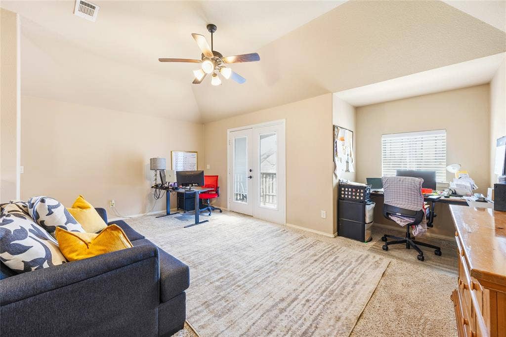 1133 Vickery Drive, DeSoto, TX 75115 When a shared space is needed, this can be it. Featuring a vaulted ceiling and a ceiling fan with integrated lighting.