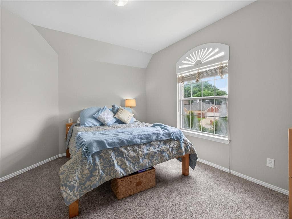 1712 Tealwood Lane, Corinth, TX 76210 Bedroom featuring light gray walls, gray carpet flooring, and white baseboards