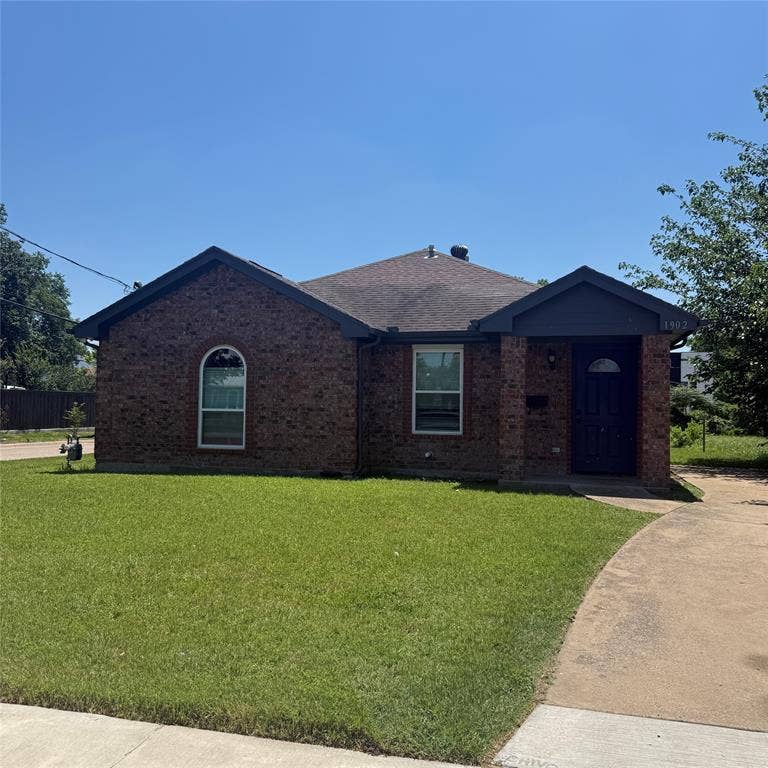 1902 Angelina Drive, Dallas, TX 75212 Brick facade residence featuring a dark asphalt shingle roof and a front entry porch