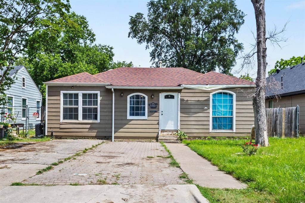 2006 Fort Worth Street, Grand Prairie, TX 75050 Single-story residence featuring horizontal siding and a red shingle roof