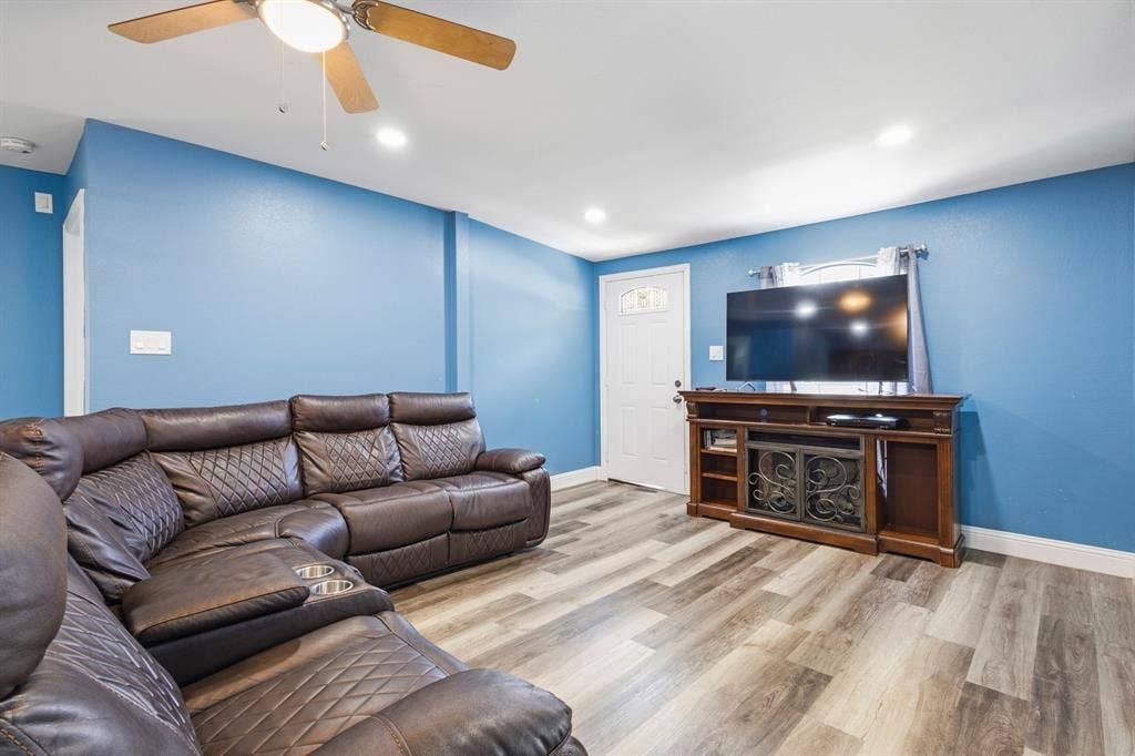 2006 Fort Worth Street, Grand Prairie, TX 75050 Spacious room featuring wood-finish flooring, recessed lighting, and a ceiling fan