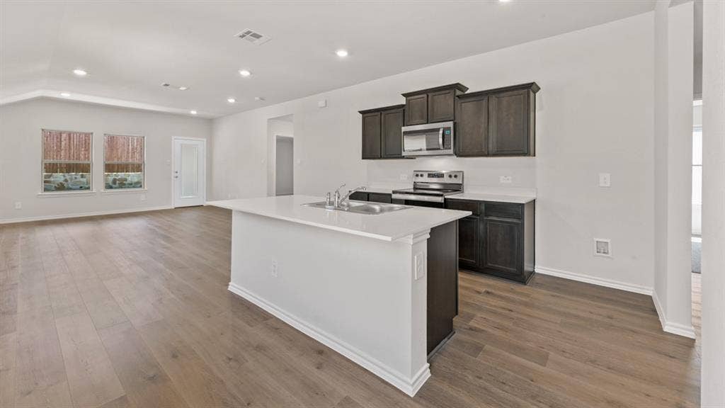 1631 Blaire Drive, Tyler, TX 75702 Open concept living area with wood-finish flooring
