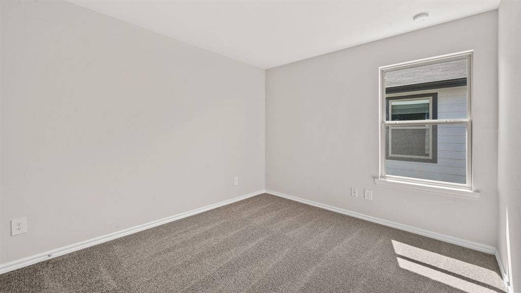 1631 Blaire Drive, Tyler, TX 75702 Neutral wall paint and grey carpet flooring