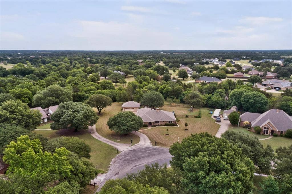 1151 Lynn Way, Waxahachie, TX 75165 Expansive residential area featuring numerous mature trees and substantial green spaces