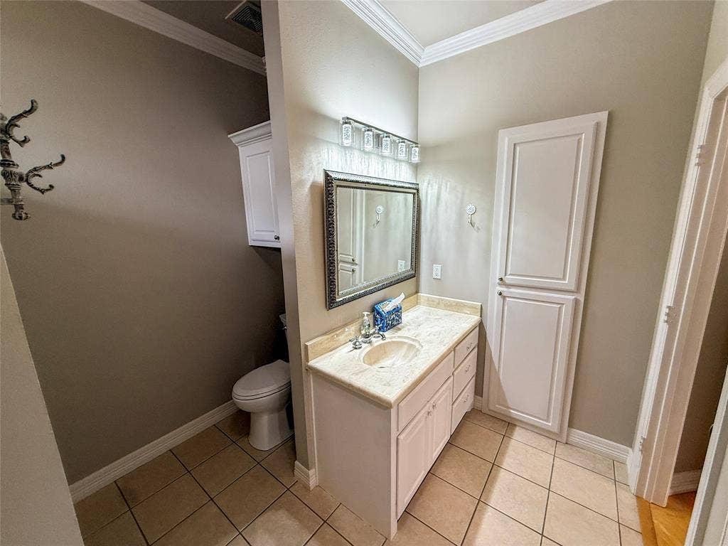 5 Woodlawn Way, Star Harbor, TX 75148 Bathroom vanity featuring a light-toned countertop, integrated sink, and white cabinetry