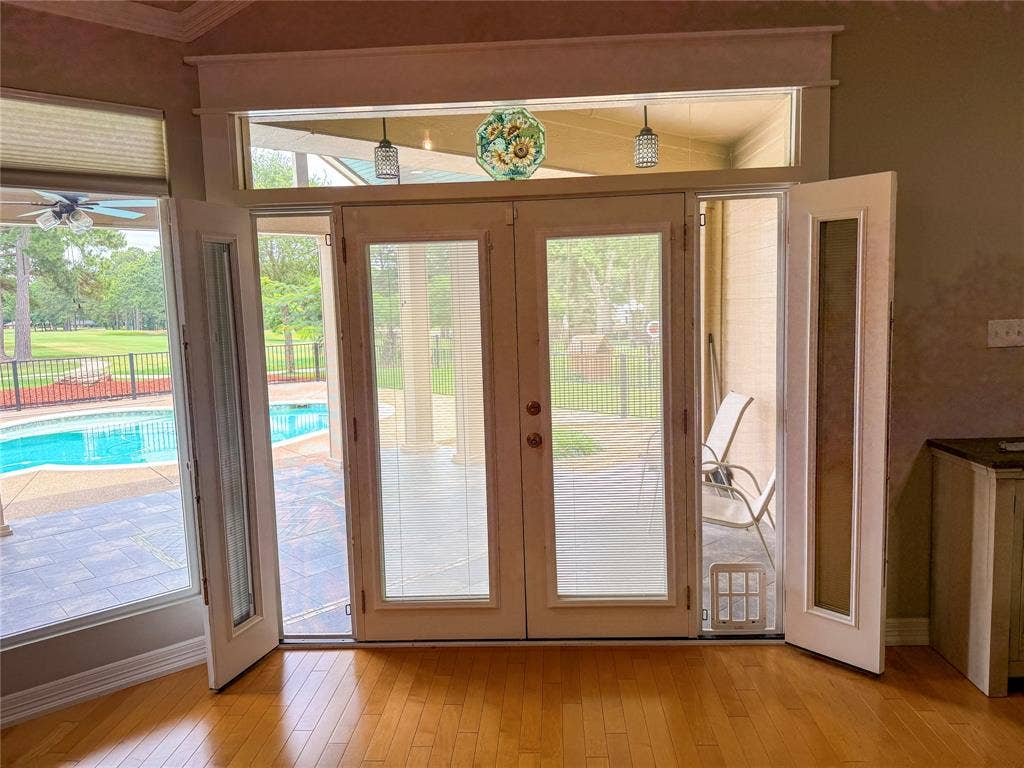 5 Woodlawn Way, Star Harbor, TX 75148 Hardwood flooring complements French doors and transom windows