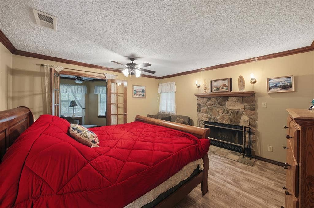 2746 Hopson Drive, Athens, TX 75752 Stone fireplace with a wood mantel