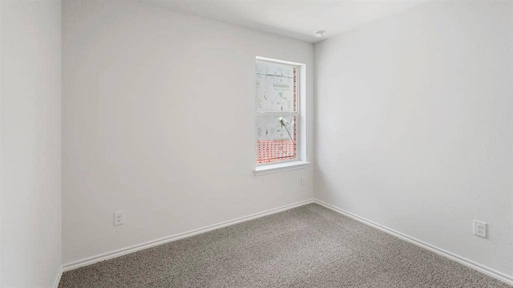 1659 Blaire Drive, Tyler, TX 75702 Room featuring a single window with white trim, light gray wall-to-wall carpeting, and white baseboards