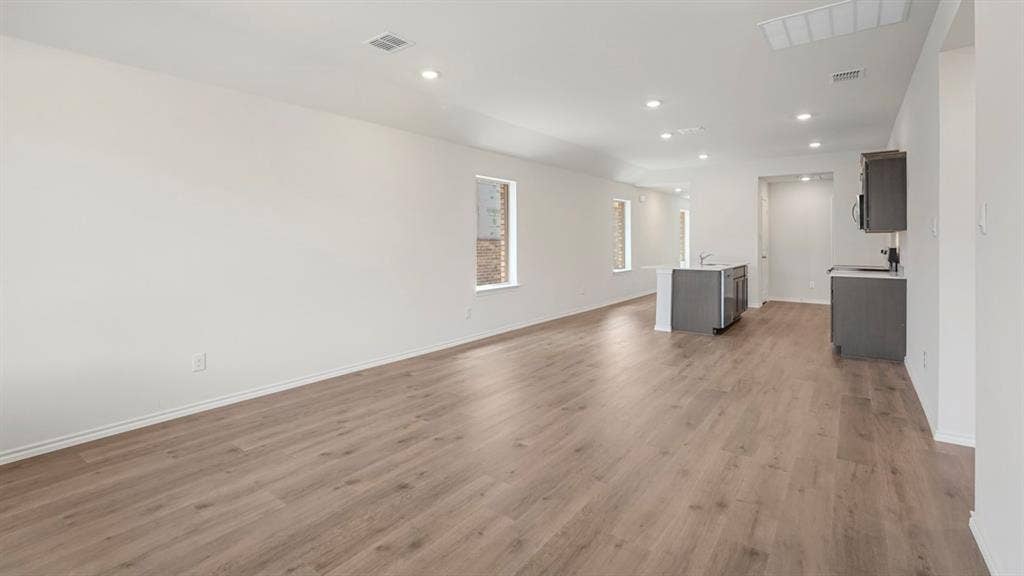 1659 Blaire Drive, Tyler, TX 75702 Spacious interior featuring wood-finish flooring, recessed lighting, and white walls