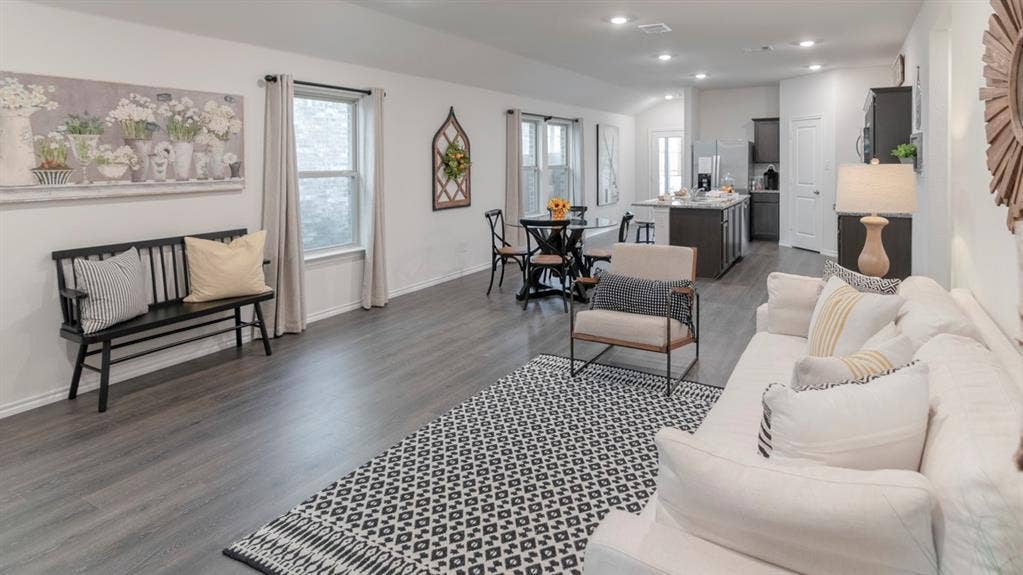 1627 Blaire Drive, Tyler, TX 75702 Open-concept living area featuring wood-finish flooring, recessed lighting, and multiple windows