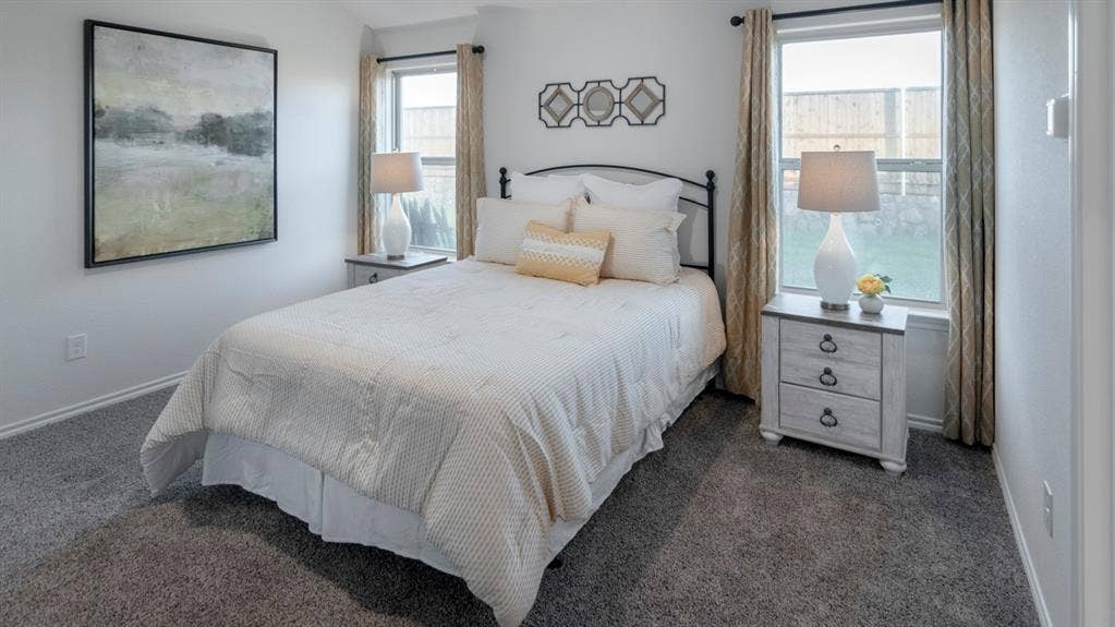 1627 Blaire Drive, Tyler, TX 75702 Carpeted interior space featuring white walls and two windows with drapes
