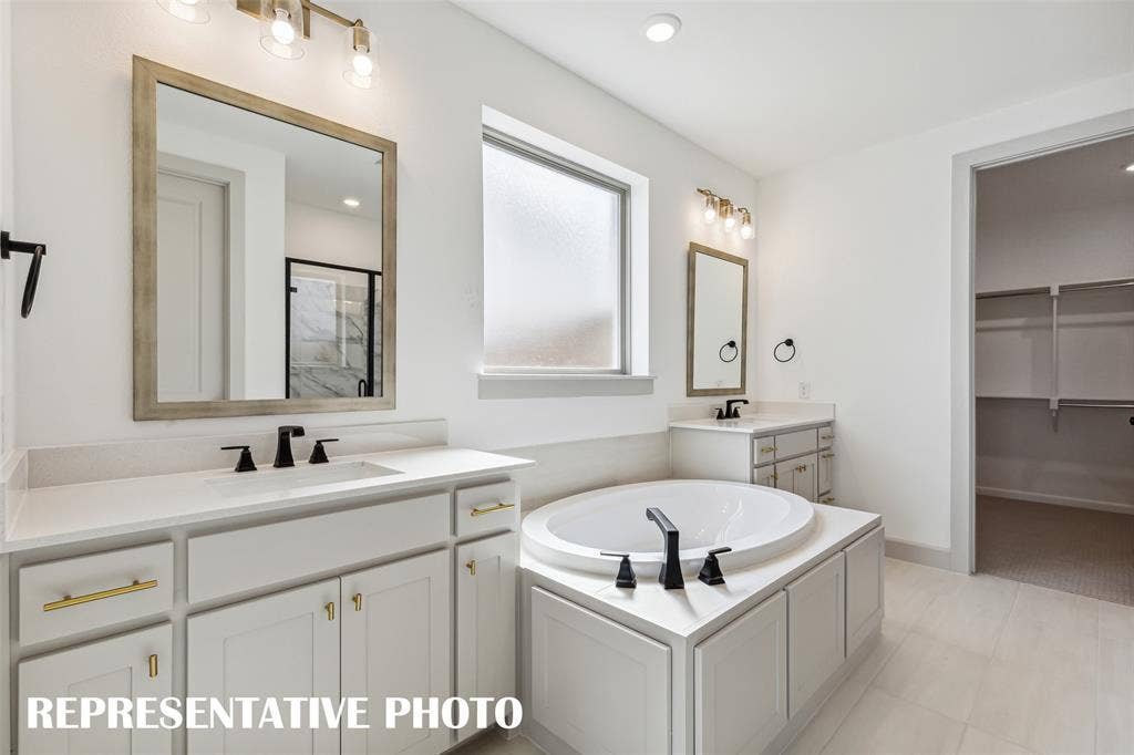 1290 Chickadee Street, Prosper, TX 75078 You'll find ample room for two in this beautiful owner's bath. REPRESENTATIVE PHOTO