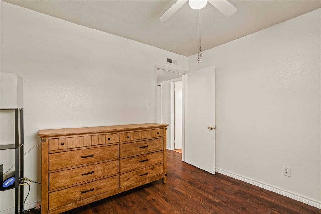 1037 Whitewater Trail, DeSoto, TX 75115 Room featuring wood-finish flooring, white painted walls, and a ceiling fan