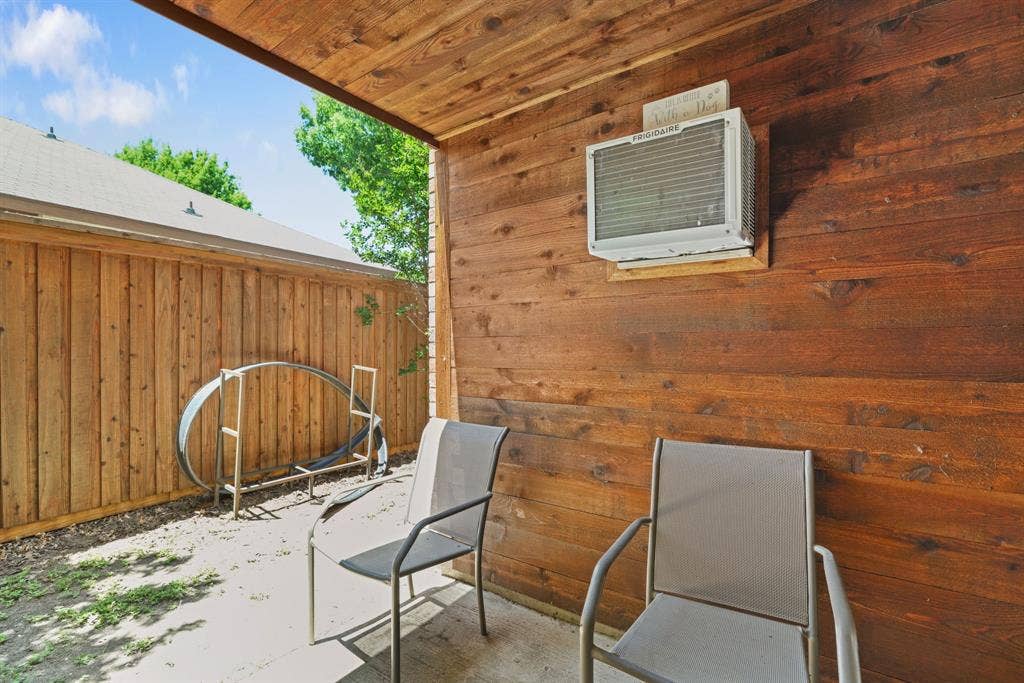 1037 Whitewater Trail, DeSoto, TX 75115 Covered outdoor patio area featuring a stained wood plank ceiling and wall