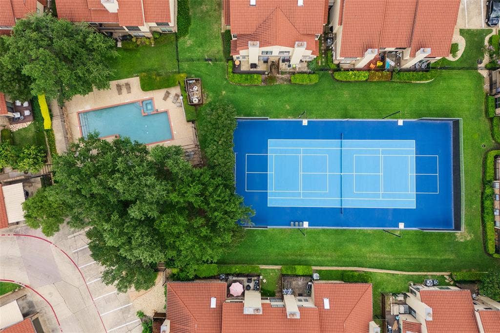 4130 Proton Drive, #47B, Addison, TX 75001 Overhead aerial of La Mirada's community amenities — a sparkling pool with adjacent spa and sun deck, and a full tennis/pickleball court surrounded by manicured greenspace.