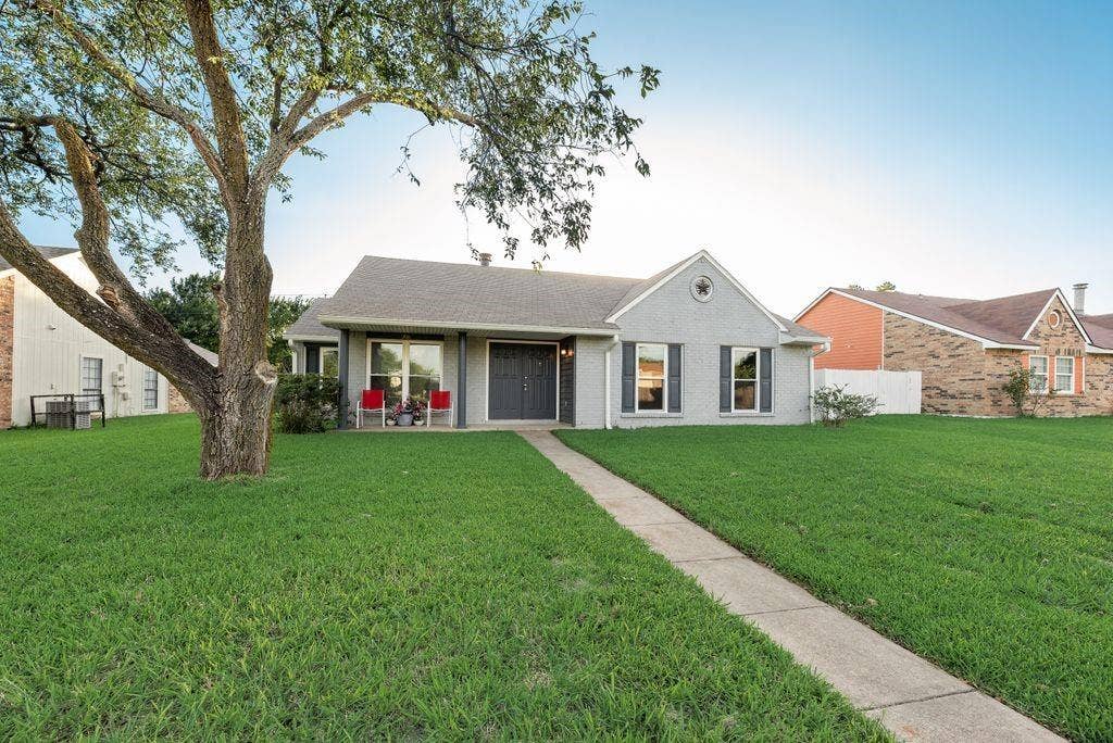 316 Matterhorn Street, Cedar Hill, TX 75104 Single-story residence featuring a gray exterior with a contrasting dark gray front door