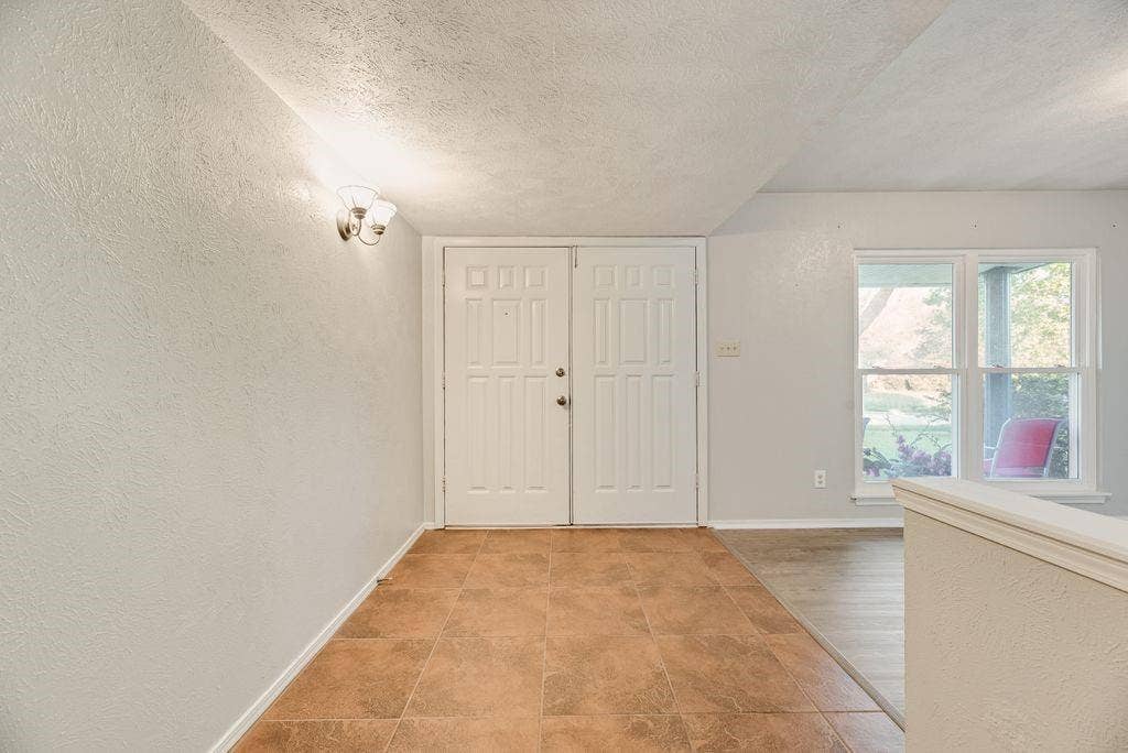 316 Matterhorn Street, Cedar Hill, TX 75104 Entryway featuring double panel doors and warm-toned tile flooring