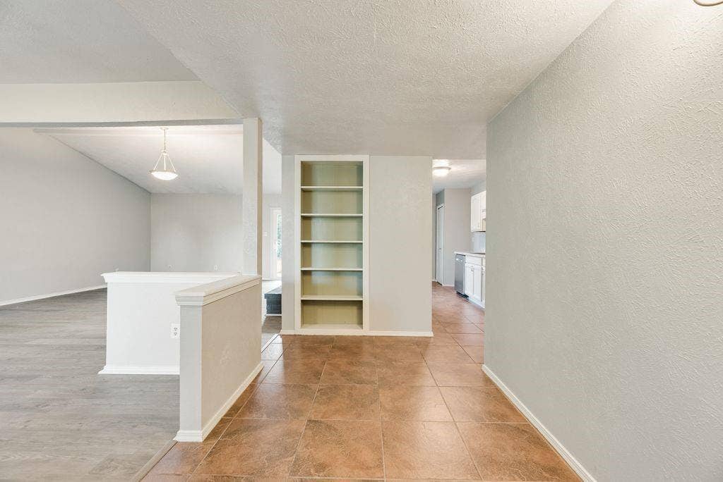 316 Matterhorn Street, Cedar Hill, TX 75104 Entryway featuring tile flooring, built-in shelving, and light-toned walls