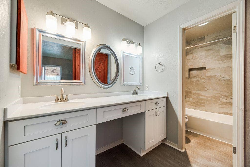 316 Matterhorn Street, Cedar Hill, TX 75104 Bathroom featuring a dual vanity with white cabinetry, brushed nickel hardware, and a white countertop