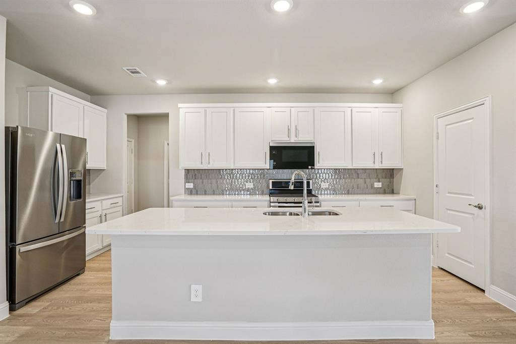 3053 Texoma Boulevard, Farmersville, TX 75442 Photo is not of the actual home, but is an inspirational photo of builder’s model home and may depict options, furnishings, and/or decorator features that are not included.