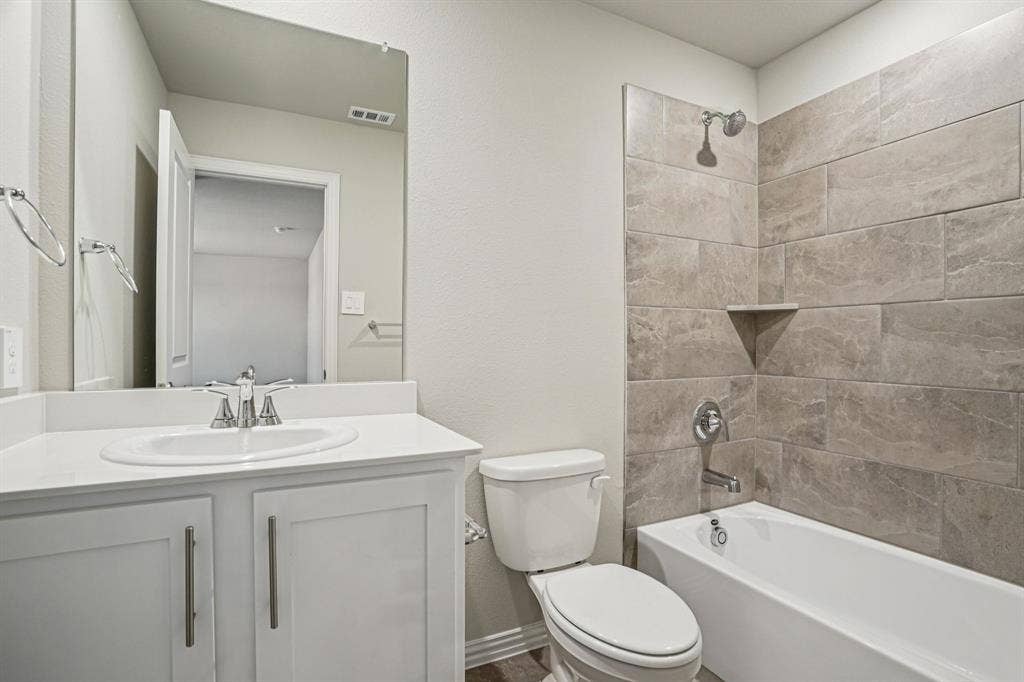 3053 Texoma Boulevard, Farmersville, TX 75442 Photo is not of the actual home, but is an inspirational photo of builder’s model home and may depict options, furnishings, and/or decorator features that are not included.