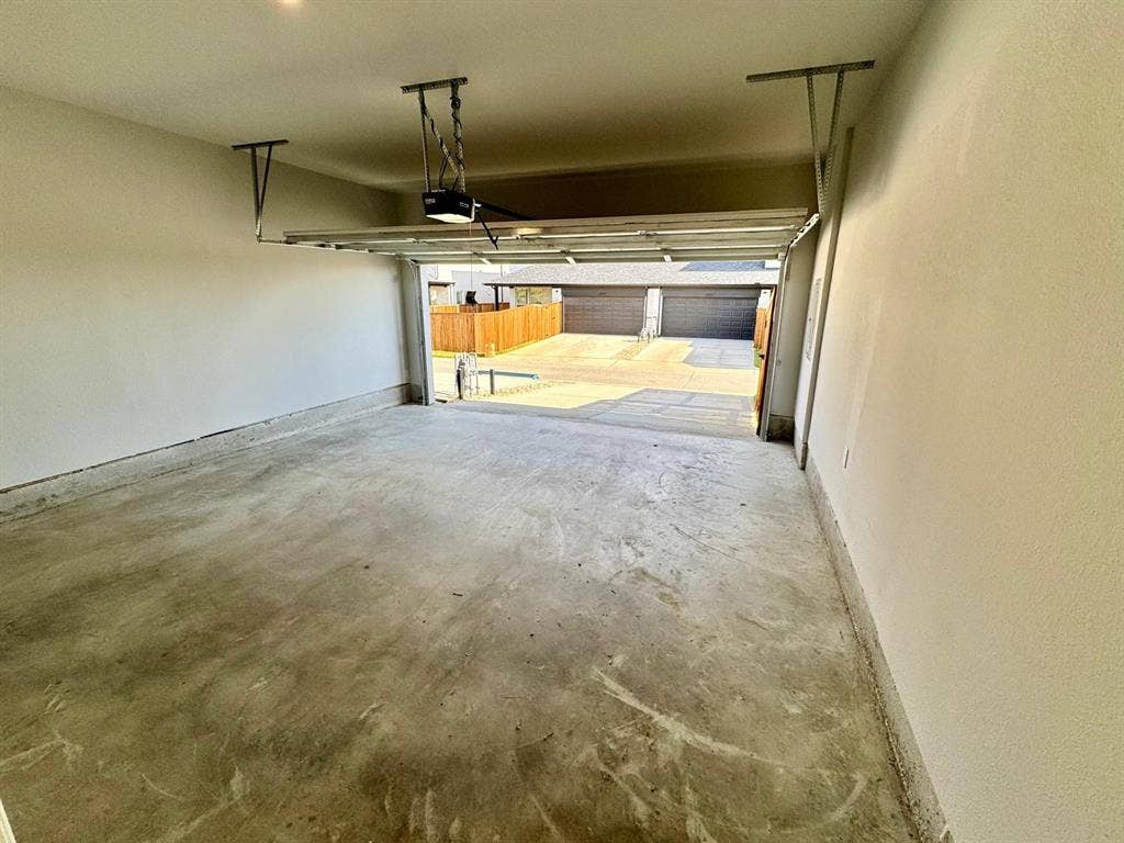 2930 Eleanor Drive, Prosper, TX 75078 Garage featuring a garage door opener