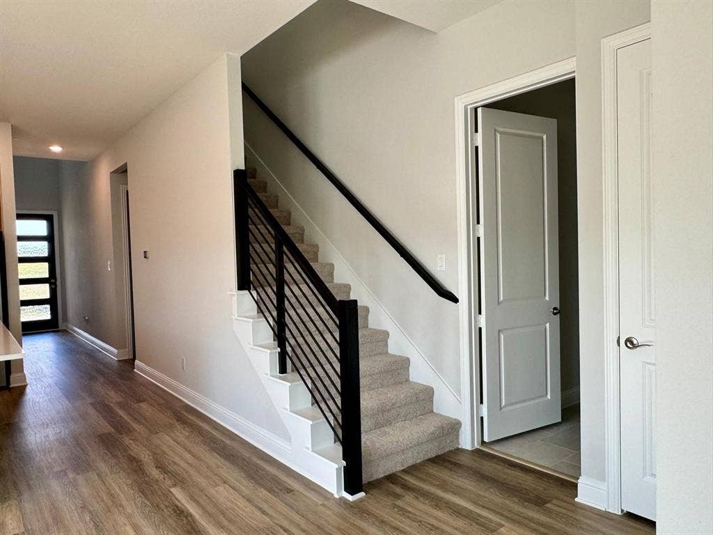 2930 Eleanor Drive, Prosper, TX 75078 Stairway with wood finished floors and recessed lighting