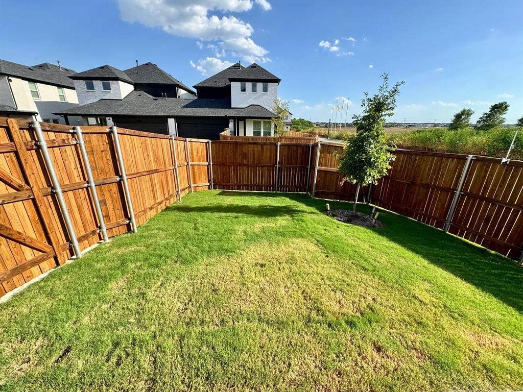 2930 Eleanor Drive, Prosper, TX 75078 Fenced backyard with a residential view