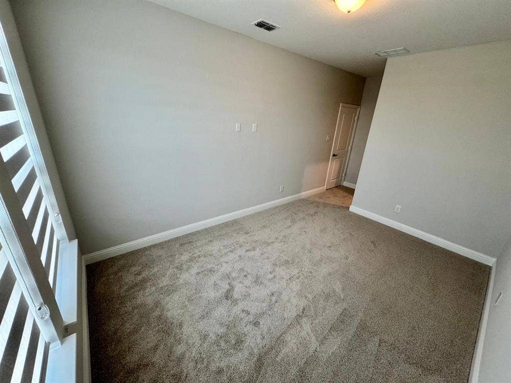 2930 Eleanor Drive, Prosper, TX 75078 Carpeted empty room with baseboards