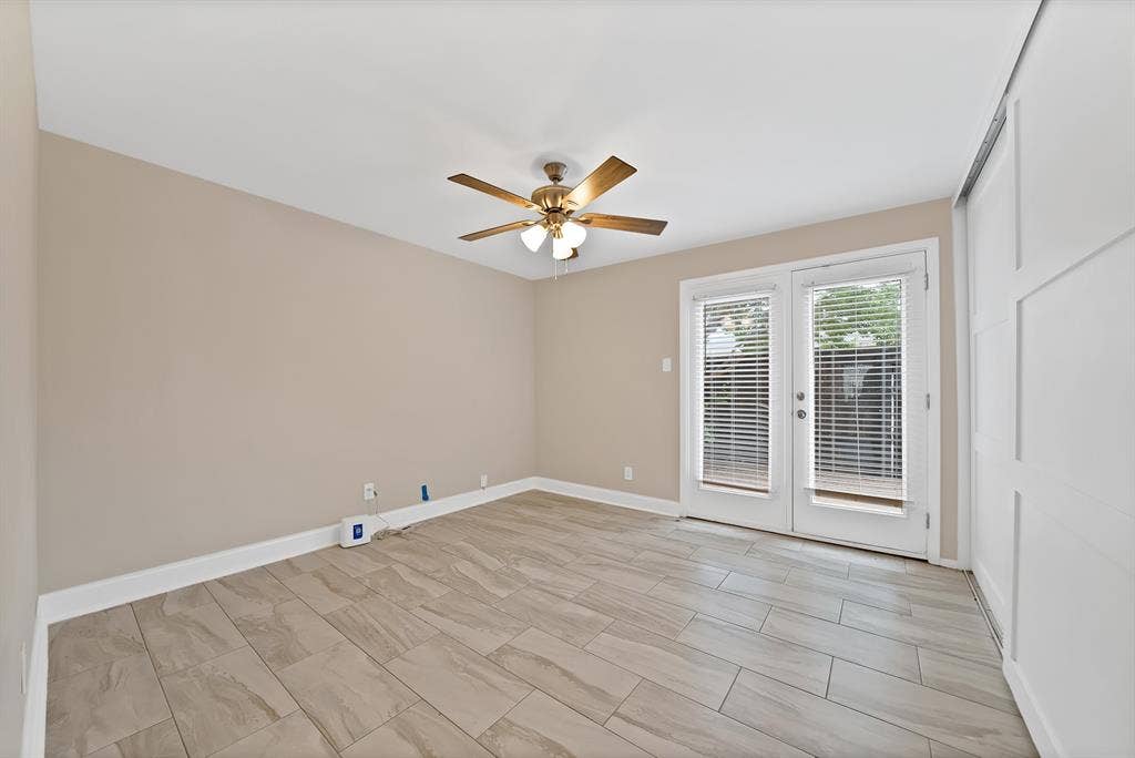 5904 Sandhurst Lane, #145, Dallas, TX 75206 Bedroom 2 with doors to back deck