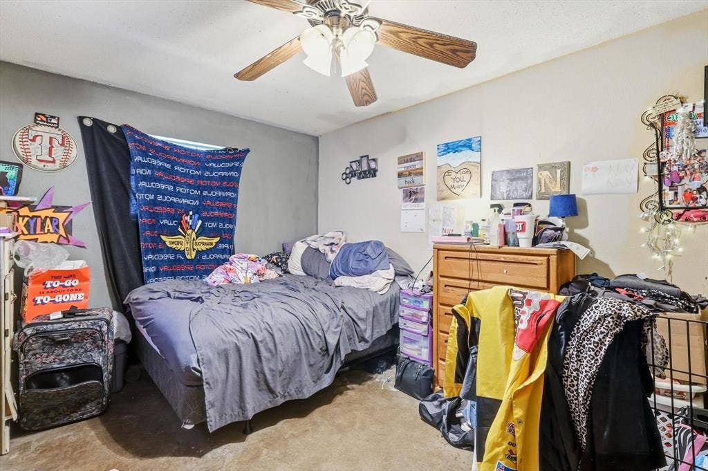 6406 Nicole Way, Arlington, TX 76002 Bedroom featuring a ceiling fan with wood-finish blades and light-toned walls