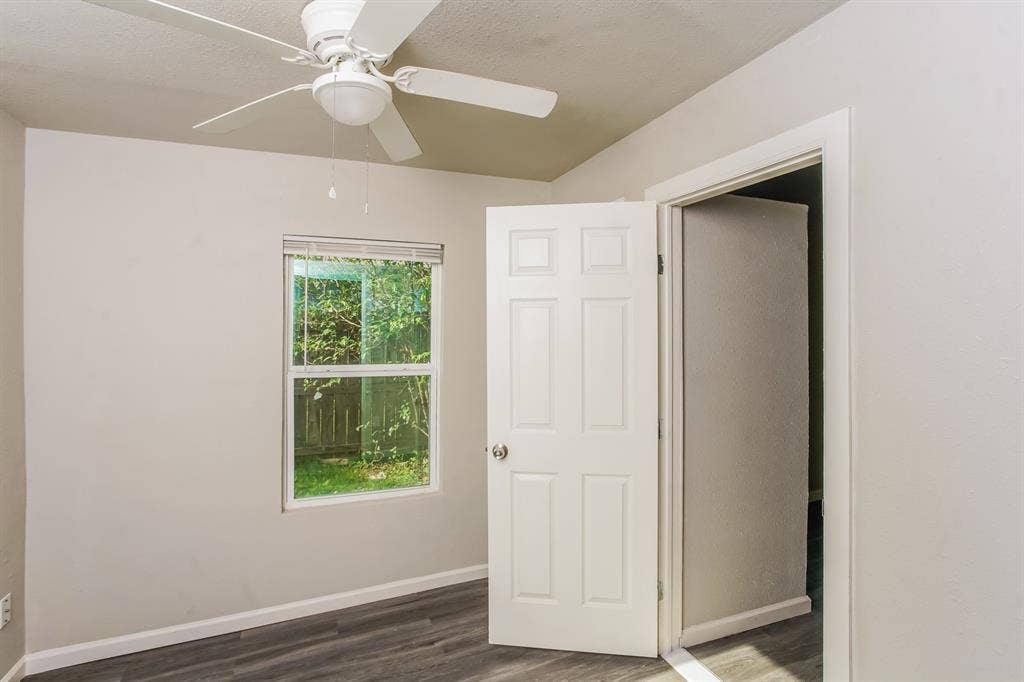 2402 Summer Avenue, Waco, TX 76708 Room featuring light gray painted walls and wood-finish flooring