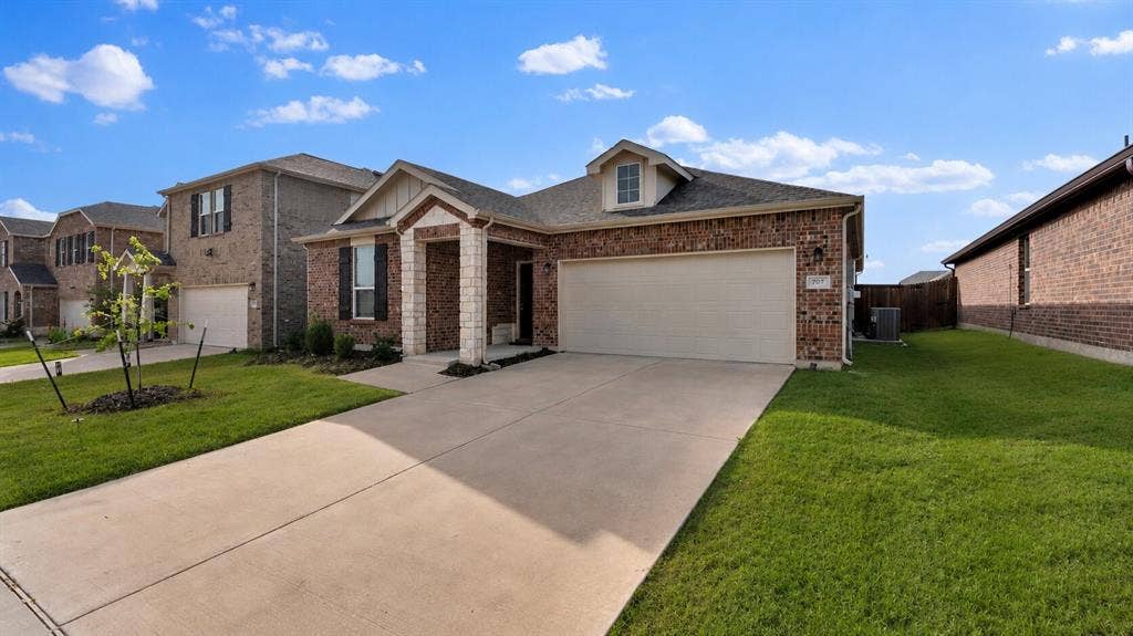707 Indigo Road, Princeton, TX 75407 Brick exterior with stone accents and a covered entry