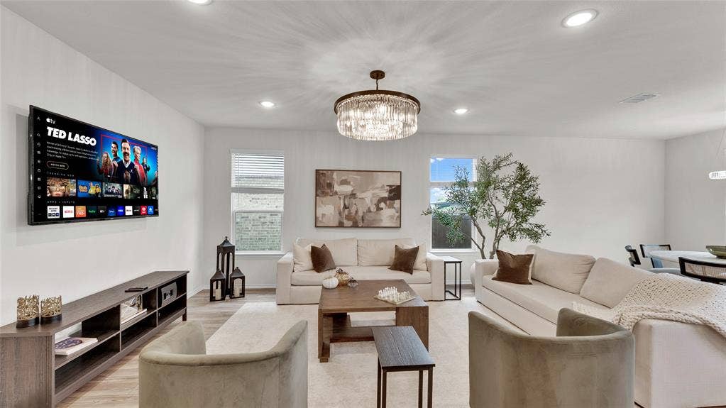 707 Indigo Road, Princeton, TX 75407 Spacious interior featuring recessed lighting, a modern chandelier, and wood-finish flooring